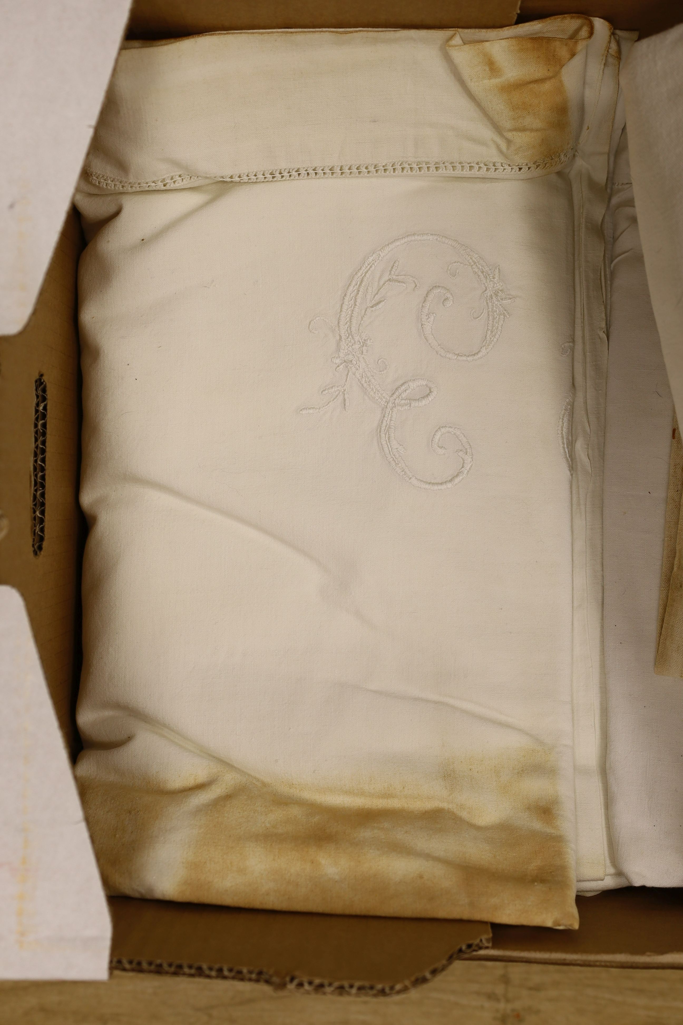 Twelve French provisional coarse linen sheets with embroidery.